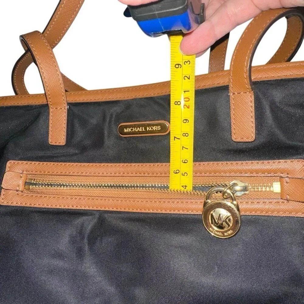 Michael kors black purse w/ tan trim 6 pockets